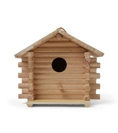 a wooden birdhouse with a hole in the roof