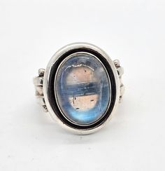 Nicky Butler NB Moonstone large flashy vintage sterling silver ring. Good used condition with little to no signs of normal wear. Great vintage patina. Stamped NB 925 India on the inside of the band. Beautiful large flashy stone with a chevron rainbow band in the top of the stone. Acid tests positive for sterling silver. Ring measures size 7. Vintage Silver Moonstone Ring With Large Stone, Vintage Large Moonstone Ring In Sterling Silver, Vintage Silver Open Moonstone Ring, Rainbow Band, Vintage Sterling Silver Rings, Guinea Bissau, Vintage Sterling Silver, Sterling Silver Ring, Moonstone