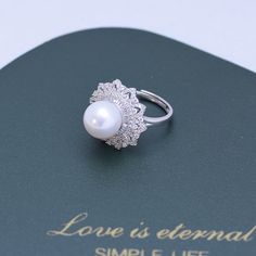 Get dressed up with our 10-11mm Freshwater Pearl & Round Cubic Zirconia. It has the perfect combination of elegance and style. The freshwater pearl creates a timeless look that makes this piece an ideal choice for any outfit. The round cut Cubic Zirconia add just the right amount of sparkle and shine to the overall design. This ring is perfect for special occasions or everyday wear, so you can show off your glamourous side no matter where you go. 10-11mm Freshwater Pearl Earrings This popular ea Elegant White Round Cut Pearl Ring, Elegant Pearl White Rings With Brilliant Cut, Elegant Brilliant Cut Pearl Ring, Elegant Pearl Drop Diamond Ring For Anniversary, Elegant Diamond Ring With Pearl Drop For Anniversary, Elegant Diamond White Pearl Ring With Diamond Accents, Elegant Diamond White Pearl Rings, Elegant Pearl Rings In Diamond White, Elegant Diamond White Pearl Wedding Ring