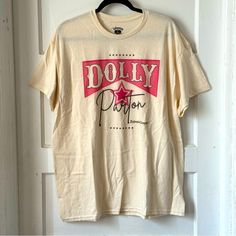 Dolly Parton Signature Unisex T-Shirt Size Xl 100% Cotton The T-Shirt Is Not White & Has A Natural Unbleached Cotton Look To It Measurements Are In The Photos. Color May Be Different In Person Due To Varying Screens & Lighting. I Do My Best To Make Any Issues Clear If None Stated And Pictured Then There Are None. Free But Friendly Home. 5 Star Rated & Quick Shipper. Bundle To Save A Minimum Of 10%. Dolly Parton Signature, Dolly Parton Shirt, Dolly Shirt, Then There Were None, Dolly Parton, Unisex Tshirt, Be Different, 5 Star, Unisex T Shirt