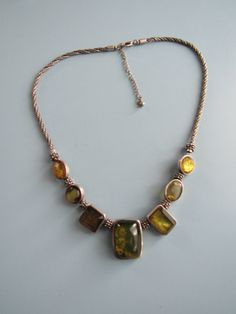 This vintage silver tone costume necklace with yellow green stones is in nice condition.  The necklace is about 22 inches in length at its longest, but there are shorter options. Free domestic shipping. Yellow Costume Jewelry Necklace For Formal Occasions, Yellow Costume Jewelry Necklace For Formal Events, Yellow Metal Costume Jewelry Necklace, Stone Costume, Kala Ukulele, Costume Necklace, Costume Necklaces, Green Stones, Green Stone