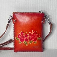 Women’s Rustic Leather, Tooled, Hibiscus Art, Mini Crossbody Bag, Rustic Leather Hawaiian Crossbody Phone Bag With Adjustable Crossbody Or Shoulder Strap. Condition: In Like-New, Clean, Undamaged, Gently Used, Or Unused, Preowned Condition. No Defects. No Flaws. Tags: Women’s Crossbody Bags, Rustic Tooled Leather Phone Bags, Women’s Handbags, Tropical Handbag, Tropical Bags, Women’s Mini Tooled Leather Handbag, Mini Tooled Leather Hawaiian Crossbody Bag, Women’s Bags, Crossbody Bags, Embroidered Red Leather Pouch Phone Bag, Red Leather Phone Bag Pouch, Small Pouch For Everyday Use, Small Shoulder Bag For Daily Use, Small Travel Shoulder Bag, Small Leather Phone Bag, Rustic Leather Bag, Cognac Leather Bag, Vacation Purse