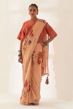 Vaguely tangerine orange pure linen handloom saree with big floral patterns prints. Comes with unstitched blouse piece.
Components: 2
Pattern: Printed
Type Of Work: Floral
Fabric: Pure Linen
Color: Orange
Other Details: 
Scalloped hem saree
Tassel edged palla
100 count handcrafted linen base
Dimensions:
Width: 45 inches
Length: 5.5 mtrs
Note:
The unstitched blouse is same as shown in the image.
The stitched blouse worn by the model is not for sale.
Occasion: Puja - Aza Fashions Festive Orange Floral Print Dupatta, Unstitched Chanderi Blouse Sets In Orange, Orange Chanderi Set With Unstitched Blouse, Festive Orange Traditional Wear With Printed Motifs, Unstitched Orange Cotton Silk Blouse Piece, Unstitched Orange Blouse Piece In Cotton Silk, Orange Handloom Pre-draped Saree, Navratri Orange Tussar Silk Blouse Piece, Orange Cotton Silk Blouse Piece