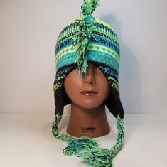 Fringed Tribal Print Hat. Nwt. Can Be Worn By Either Gender. Very Stretchy And Light Weight. Funky Winter Festival Hats, Fun Winter Festival Hats, Adjustable Multicolor Winter Hat, Adjustable Green Winter Hats, Funky Winter Hat One Size Fits Most, Adjustable Rave Hats For Festivals, Bohemian Fitted Hat For Winter, Fitted Warm Green Hat, Bohemian Fitted Winter Hat