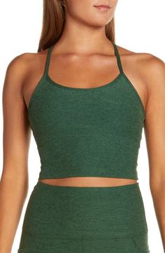 Cropped, but not short on comfort, this racerback tank is made from four-way-stretch performance fabric with an ultrasoft feel and quick-drying capabilities. 14 1/2" length (size Medium); 16" length (size 3X) Scooped neck Racerback Built-in shelf bra Moisture-wicking fabric dries quickly to keep you cool and comfortable 87% polyester, 13% spandex Machine wash, tumble dry Made in the USA of imported fabric Women's Active & Swim Yoga Clothing Brands, Barre Clothes, Yoga Pants Fit, Best Yoga Clothes, Stylish Crop Top, Yoga Space, Yoga Pants With Pockets, Alo Yoga Pants, Beyond Yoga