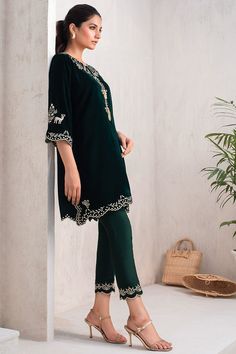 Elegant and sophisticated, this deep shade of emerald is cut from the softest velvet. The kurta is finished with scalloped edges and modern detailing. The matching raw silk trousers follow through with the attention to detailing on the cuffs. Velvet Kurta, Emerald Velvet, Website Features, Silk Trousers, Scalloped Edges, Raw Silk, Scalloped Edge, Soft Velvet, Online Branding