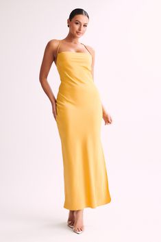 An understated and elegant silhouette for the modern muse. The much-loved SYDNEY Straight Neck Slip Maxi Dress returns in a fresh hue for a season of celebrations. Boasting a squared neckline and head-turning open back, this midi features a cross back design with a self-tie feature for a customised fit. Team with barely-there heels to keep Sydney in the spotlight. FEATURES: Squared neckline Skinny straps Adjustable cross-back design Straight cut from hip to hem Maxi length FIT, FABRIC & CUT: Ede Solid Dress With Straight Neckline For Date Night, Chic Midi Dress With Square Neck And Tie Back, Fitted Midi Dress With Straight Neckline For Prom, Formal Fitted Maxi Dress With Strappy Back, Fitted Strappy Back Formal Dress, Fitted Formal Dress With Strappy Back, Fitted Midi Dress With Tie Back And Straight Neckline, Square Neck Maxi Dress For Date Night, Chic Square Neck Dress With Tie Back