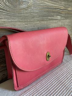 "It is a pre owned vintage FOSSIL bag and shows signs of wear. The exterior does come with scuffing at the edges, leather discoloring and some surface scratches from normal used. The inside looks clean and undamaged. The hardware is functional. The bag is in good overall used condition. FREE DOMESTIC SHIPPING Bag length 9.5 Bag height 6.5\" Bag depth 2.5\" Strap drop 13\" Please view the photos to evaluate the condition. Any questions regarding an item, please ask prior to making your purchase. Pink Leather-lined Satchel Bag, Pink Leather-lined Satchel Shoulder Bag, Pink Satchel Shoulder Bag With Leather Lining, Vintage Pink Shoulder Bag For Everyday, Pink Vintage Shoulder Bag, Vintage Pink Leather Shoulder Bag, Vintage Pink Satchel For Everyday Use, Vintage Pink Crossbody Shoulder Bag, Vintage Saddle Bag With Removable Pouch