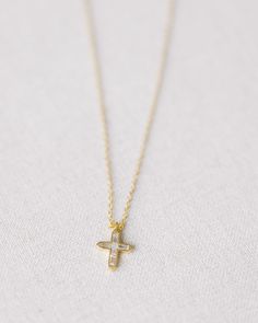 This Gold Crystal Cross Necklace is crafted with gold vermeil and features a crystal cross. With timeless elegance and sparkling beauty, this necklace is a classic piece. measures 18.5" at longest, 16.5" at shortest Gold Cross Necklace With Delicate Chain In Sterling Silver, Dainty Gold Sterling Silver Cross Necklace, Delicate Yellow Gold Cross Pendant Necklace, White 14k Gold Cross Pendant Necklace, Delicate Gold Cross Pendant Necklace, Delicate Gold Cross Jewelry, Dainty Gold Cross Necklace For Anniversary, Gold Sterling Silver Cross Necklace For Anniversary, Gold Cross Pendant Necklace For Anniversary