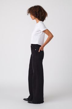 Make a statement in our best-selling high-rise, wide leg silhouette. With an easy fit though the hip and thigh, full inseam, slight distressing at the pockets and a released, raw hem, they're your new everyday denim. Zip fly. WASH: BLACK OAK FIT & MEASUREMENTS: Inseam = 32 1/2" Front Rise = 12" Back Rise = 16" Leg Opening = 23" Measurements taken from size 27 Taliha is wearing a size 25 and is 5'10" Sophie is wearing a size 25 and is 5'10" Take your normal size for a full easy fit, or size down to be more fitted around the waist Fabric & Care: 98% Cotton, 2% Elastane Machine wash cold, and either hang dry or tumble dry low heat Made with love in Los Angeles Modern Straight Leg Jeans With Frayed Hem, Chic Everyday Bottoms With Standard Cut Leg, Chic Everyday Jeans With Standard Cut Leg, High Rise Cotton Wide Leg Pants With Frayed Hem, Relaxed Fit Wide Leg Jeans With Frayed Hem, Everyday Full Length Flare Jeans With Frayed Hem, Everyday Flare Jeans With Frayed Hem, Chic Flare Jeans With Relaxed Fit, Everyday Wide Leg Bottoms With Frayed Hem