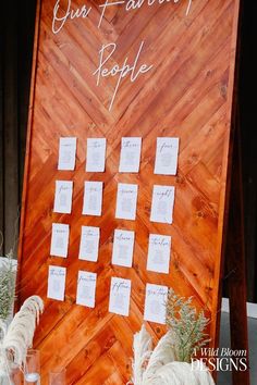 a wooden sign that says our favorite people on it with notes attached to the board