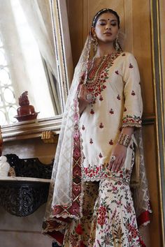 Ivory kurta with floral embroidery in silk base. Paired with an all over floral embroidered sharara and dupatta.
Components: 3
Pattern: Embroidered
Neckline: Notched
Sleeve Type: Three-quarter
Fabric: Kurta and Sharara: Silk, Dupatta: Net
Color: Ivory
Occasion: Mehendi and Haldi - Aza Fashions Vikram Phadnis, Kurta And Sharara, Embroidered Sharara, Kurta Sharara Set, Floral Set, Sharara Set, Embroidered Neckline, Silk Dupatta, Embroidered Silk