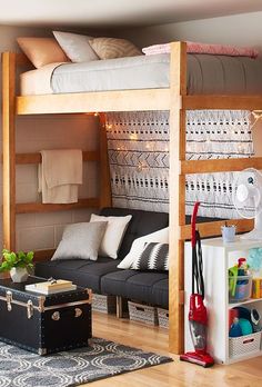 a bunk bed with a couch underneath it