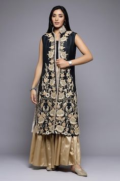 Black and gold long jacket style kurta with Mughal floral embroidery. Paired with a gharara. - Aza Fashions Elegant Front Open Sharara For Eid, Floor-length Raw Silk Sharara With Gold Embroidery, Designer Long Sharara With Intricate Embroidery, Long Sharara With Zari Work For Transitional Season, Floor-length Sharara With Gold Embroidery For Eid, Bollywood Style Sharara With Gold Embroidery And Straight Kurta, Designer Floor-length Sharara With Gold Embroidery, Festival Sharara With Gold Embroidery And Straight Kurta, Gold Straight Kurta Palazzo Set For Reception