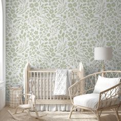 a baby's room with a crib and rocking chair