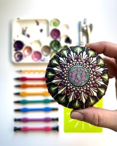 Dot mandala stone painted with dotting tools from The Dotting Center.