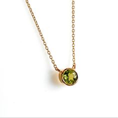 The summer tones of peridot are wrapped in this gold bezel birthstone pendant necklace14K Yellow GoldPeridot 0.36ctLobster clasp Summer Tones, Solitaire Necklace, Peridot Pendant, Solitaire Necklaces, Birthstone Pendant, Birthstone, Yellow Gold, Pendant Necklace, Yellow