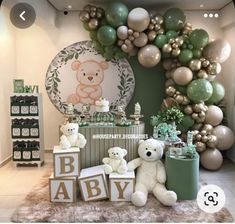 a teddy bear themed baby shower with balloons and decorations on the wall, including letters that spell it's a boy