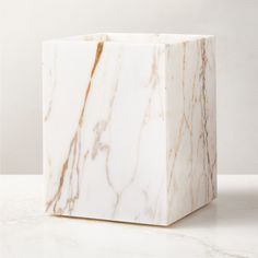 Rectangular wastebasket is crafted of Calacatta gold marble with rich natural veining and a smooth finish. Pair with the full Ramsey Calacatta gold marble bath collection for a coordinated look. CB2 exclusive.     Solid Calacatta gold marble  Variation in veining and activity of marble is to be expected; each will be unique  Wipe with a soft cloth  Imported Ramsey Calacatta Gold Marble Wastebasket Trash Can Bathroom, Bathroom Waste Basket, Calacatta Gold Marble, Marble Bath, Bath Collection, Calacatta Gold, Black Tree, Soap Pump, Popular Products