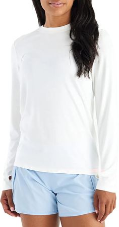 Fit & Design: Regular fit shirt Long sleeves Longer length for added coverage Set-in sleeves with set forward shoulder seam Thumbholes for a perfect fit Crew neckline provides a classic, snug fit Technology: UPF 30+ sun protection shields from the sun's harmful rays Sporty Long Sleeve Top For Spring, Stretch White Long Sleeve Top, White Stretch Long Sleeve Top, Sporty Long Sleeve Shirt For Spring, Bamboo Shades, Outdoor Apparel, Long Length, Bright White, Sun Protection