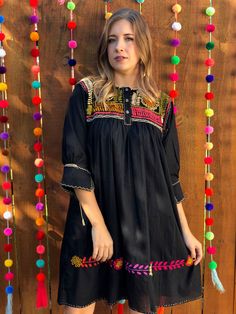 This gorgeous Embroidered dress is traditional yet modern. It is one of a kind! Festival Dresses With Geometric Embroidery, Festive Geometric Embroidered Dress, Traditional Black Tunic Dress, Folk Style Festive Dress With Multicolor Embroidery, Festive Bohemian Dress With Embroidered Sleeves, Geometric Embroidery Dresses For Festivals, Festive Dress With Geometric Embroidery For Festivals, Festive Dresses With Geometric Embroidery, Black Dresses With Intricate Embroidery For Festivals