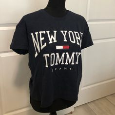 Bought This Cute T Shirt From Pacsun But Just Never Reached For It. It’s Semi Cropped And Fits Loosely For A Small. The Logo And Design On Front Is Printed Very Well And It’s New With Tags! Never Worn! It’s Such A Cute Look For A Lunch Date Or Even Just Lounging At Home. Blue Tommy Hilfiger T-shirt With Letter Print, Tommy Hilfiger Blue T-shirt With Letter Print, Tommy Hilfiger Graphic Tee With Graphic Print, Tommy Hilfiger Blue Summer T-shirt, Tommy Hilfiger Graphic Print Tee, Trendy Tommy Hilfiger Cotton T-shirt, Sporty Tommy Hilfiger Tops With Graphic Print, Tommy Hilfiger Tops With Letter Print For Summer, Tommy Hilfiger Graphic Tee With Letter Print