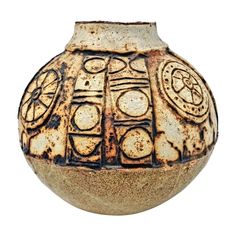 a brown vase with designs on it