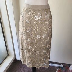 Badgley Mischka Floral Sequin And Beaded Skirt. Crafted From High-Quality Silk, Lined, Knee-Length Double Vented Skirt Features A Back Zipper, Hook & Eye With Button Closure. Fits Like A Size 8. New Nwot Never Worn. Size: 10 Color: Beige Elegant Sequined Skirt For Holidays, Elegant Sequined Skirt For The Holidays, Elegant Holiday Skirt With Sequins, Glamorous Embellished Long Skirt, Elegant Sequined Mini Skirt, Glamorous Long Embellished Skirt, Elegant Embellished Pencil Skirt, Elegant Mini Skirt With Sequins, Elegant Embellished Cocktail Skirt