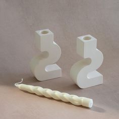 two white ceramic objects sitting next to each other