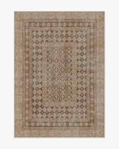 a beige rug with an intricate design on it