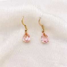 Baby Pink Faceted Teardrop Zicronia Drop Earrings - Made From 24K Gold - imitation morganite/ wedding/ bridal/ bridesmaid/ gift/ gemstone These earrings are so pretty and dainty featuring the perfect shade of baby pink Made from high quality 24K gold to ensure durability and long lasting colour Comes in a beautiful gift packaging 💗 📬 We ship worldwide ✨ Don't forget to follow my Instagram @LevanaJewellery for discount codes and competitions and to keep up to date on my latest creations ✨ - About LEVANA - We are a jewellery brand who cares about our customers, providing excellent 24/7 customer service. We exhibit a passion for creating new, unique and trendy pieces and strive to make your favourite necklace in your jewellery box or the most beautiful gift for someone you love. We are so g Gemstone Teardrop Earrings For Wedding, Gold Teardrop Gemstone Earrings For Wedding, Wedding Gemstone Teardrop Earrings, Wedding Teardrop Gemstone Earrings, Dangle Teardrop Gemstone Earrings For Wedding, Gemstone Dangle Teardrop Earrings For Wedding, Gemstone Teardrop Dangle Earrings For Wedding, Wedding Dangle Teardrop Gemstone Earrings, Elegant Pink Teardrop Earrings As Gift