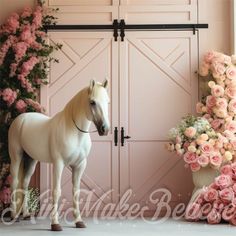 a white horse is standing in front of pink flowers and roses on the wall behind it