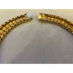 This is part of Chairish’s Costume Jewelry assortment.  A magnificent and weighty gold-tone and white enameled Ciner choker/collar, ca. late 1950s/early 1960s.  This choker belonged to a notable costume jewelry industry professional, who worked for Trifari.  Ciner jewelry was founded in New York City in 1892 as a fine jeweler and this family-owned operation is still in business today!  Since 1931, the company has produced fine costume jewelry. Luxury Yellow Gold Choker, Luxury Metal Choker For Formal Occasions, Luxury Formal Choker With 17 Jewels, Luxury Yellow Gold Choker For Formal Events, Formal Luxury Choker With 17 Jewels, Vintage Gold Plated Jubilee Bracelet, Vintage Gold Bracelet With Polished Finish, Collectible Gold Jubilee Bracelet Jewelry, Luxury Gold Choker For Formal Occasions