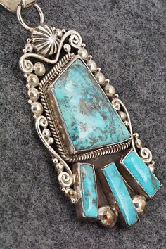 This vintage Morenci turquoise and sterling silver pendant was made by Navajo silversmith Oliver Smith. The back is signed O. Smith and stamped .925. The silver retains an aged patina.Length: 3 3/8"Width: 1 3/8"Free shipping on all orders! We ship with USPS and always include tracking. All orders ship within a day of payment.Returns are accepted up to 30 days after you receive your order. Just send us a message. Our shop offers cash back or store credit. The item must be returned in new conditio Vintage Sterling Silver Turquoise Necklace With Patina, Vintage Silver Turquoise Necklace With Patina, Oliver Smith, Morenci Turquoise, Native American Jewelry, Turquoise Jewelry, Sterling Silver Pendant, Free Jewelry, Sterling Silver Pendants