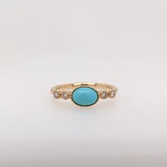 This beautiful ring features a bezel set east west turquoise gemstone of 0.73 carat with milgrain detail and natural earth mined diamonds, all set in solid 14K gold. This ring can be lovely December birthstone gift for your loved ones! This ring is made with solid 14K Gold and natural Earth mined SI / G-H diamonds. As listed, this ring is ready to ship. If you're interested in purchasing this setting with a different center stone please message us! Designer Silver Jewellery, Jewelry Showcases, Birthstone Gifts, December Birthstone, Natural Earth, Beautiful Ring, East West, Earring Findings, Pendant Bracelet