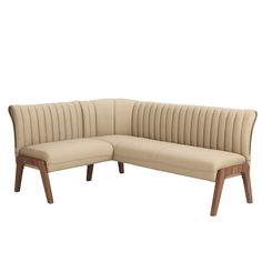 a beige leather sectional sofa with wooden legs