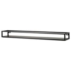 a black shelf sitting on top of a white wall