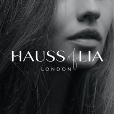 a woman's face with long hair and the words haussoflia london on it