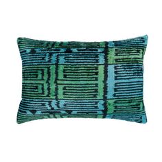 a blue and green pillow on a white background