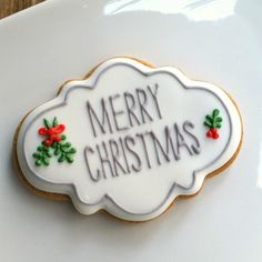 a decorated christmas cookie on a white plate