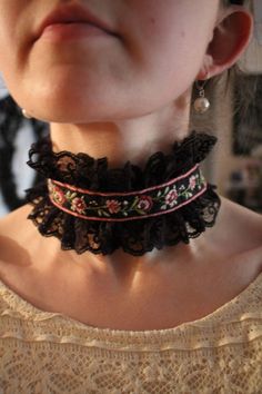 This is a hand sewn choker inspired by the victorian era. There is a ribbon of embroidery on one side and black velvet on the other. It is completely reversible and can have a broach or pin placed to give it a personalized look. Length can be adjusted in the back. Handmade Black Victorian Choker, Vintage Black Festival Choker, Vintage Black Choker For Festival, Victorian Choker, Manchester Nh, Velvet Choker, Embroidered Lace, Victorian Era, Black Velvet