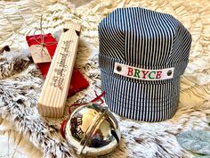 "Our Personalized Train Hats in Red/Green lettering make the perfect stocking stuffer and Christmas gift alike! Add a red bandana, plain whistle, or personalized whistle and make it a gift that will really wow the train lover on your list!   The perfect gift is the one that will last them longer than just Christmas Day!  This hat (and whistle or bandana if you select to add those options) will be a gift loved for years to come and makes the perfect keepsake!  The personalization for these engine Toddler Christmas Photos, Train Hat, Engineer Hat, Train Christmas, Christmas Express, Holiday Train, Toddler Christmas Gifts, Stocking Stuffers For Kids, Christmas Gifts For Boys