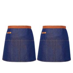 two pairs of blue denim skirts with brown leather trims on the bottom and sides