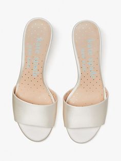 For the bride-to-be: Toss the bouquet in that magical white dress and these slide sandals, featuring a snow globe heel with a wedding cake for the occasion... | Kate Spade Love Slide Sandals, Ivory Bridal Ivory Bridal, Sheep Leather, Snow Globe, Kate Spade New York, Low Heels, Slide Sandals, Wedding Cake, Snow Globes, Wedding Events