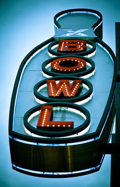 a neon sign with the word wow lit up in it's letters and numbers