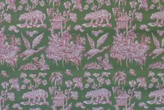 a green background with pink and white designs on it's sides, including animals