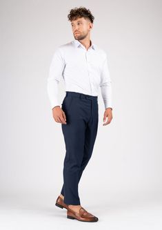 The Navy Sharkskin pants are the perfect choice for any smart occasion. Crafted with a luxurious navy sharkskin fabric and custom made for a premium appearance, they have a deep blue color, a stylish and modern cut, and will make you look and feel confident. Fitted Navy Straight Dress Pants, Navy Fitted Dress Pants For Business Casual, Fitted Navy Dress Pants For Business Casual, Elegant Navy Bottoms For Business Casual, Elegant Navy Bottoms For Semi-formal Occasions, Elegant Navy Tapered Leg Dress Pants, Navy Elegant Tapered Leg Dress Pants, Navy Slim Fit Pants For Business Casual, Navy Business Casual Pants With Straight Hem