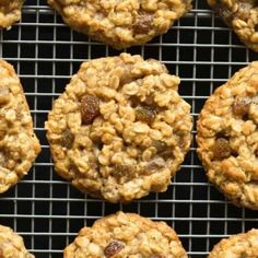 oatmeal raisin cookies cooling on a wire rack in front of a black background