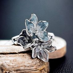 Introducing our Unique Women Ring -- a masterpiece of elegance crafted in genuine 925 sterling silver. This exquisite ring is a celebration of timeless design, making it the perfect accessory for those who appreciate the finer things in life. 🌸 Floral Delight: The delicate flower design adds a touch of femininity and charm to this unique ring, making it a standout piece in your jewelry collection. Each petal is intricately crafted, creating a symbol of natural beauty that transcends trends. 💍 Elegant Silver Flower Shaped Ring, Silver Elegant Flower Ring For Gift, Elegant Silver Flower Ring For Gift, Elegant Silver Diamond Flower Ring, Exquisite Silver Open Ring, Anniversary Sterling Silver Flower Ring For Mother's Day, Silver Vintage Flower Ring For Gift, Vintage Silver Flower Ring For Gift, Unique Silver Flower Shaped Ring