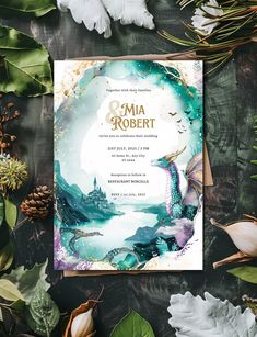 a wedding card with an image of a dragon on it and leaves around it, surrounded by greenery